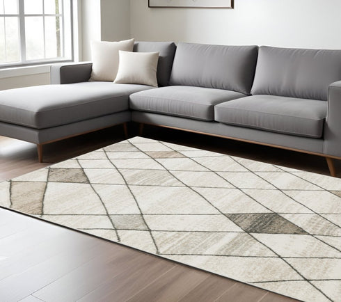 3' X 5' Beige Grey Tan And Brown Geometric Power Loom Stain Resistant Area Rug